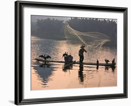 Fisherman Fishing with Cormorants on Bamboo Raft on Li River at Dusk, Yangshuo, Guangxi, China-Keren Su-Framed Photographic Print