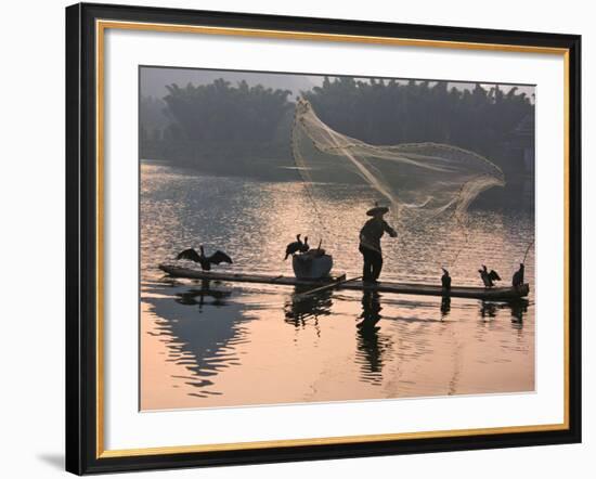 Fisherman Fishing with Cormorants on Bamboo Raft on Li River at Dusk, Yangshuo, Guangxi, China-Keren Su-Framed Photographic Print