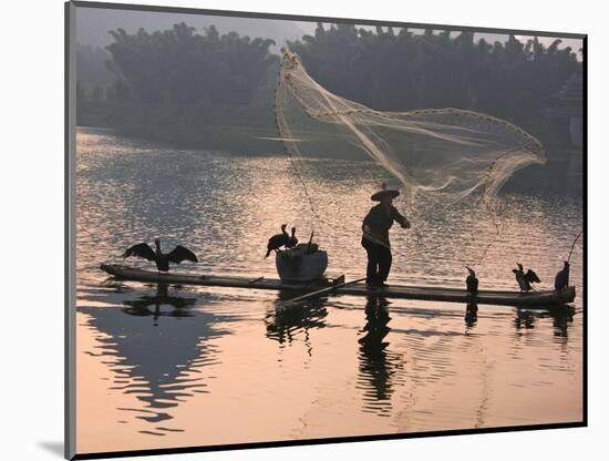 Fisherman Fishing with Cormorants on Bamboo Raft on Li River at Dusk, Yangshuo, Guangxi, China-Keren Su-Mounted Photographic Print