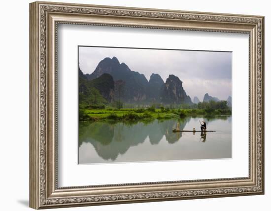 Fisherman on bamboo raft on Mingshi River at sunset, Mingshi, Guangxi Province, China-Keren Su-Framed Photographic Print