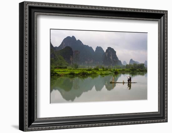 Fisherman on bamboo raft on Mingshi River at sunset, Mingshi, Guangxi Province, China-Keren Su-Framed Photographic Print