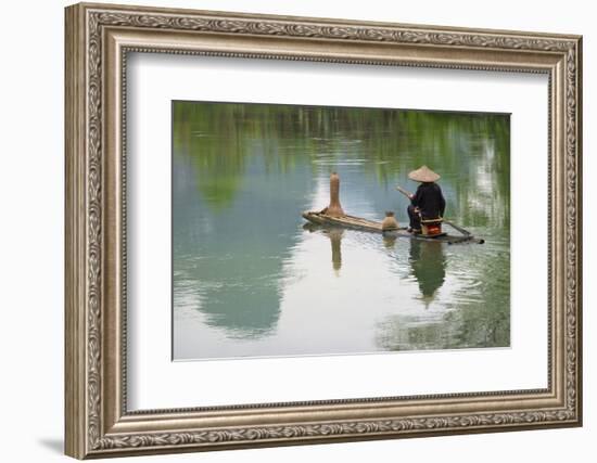 Fisherman on bamboo raft on Mingshi River with karst hills, Mingshi, Guangxi Province, China-Keren Su-Framed Photographic Print