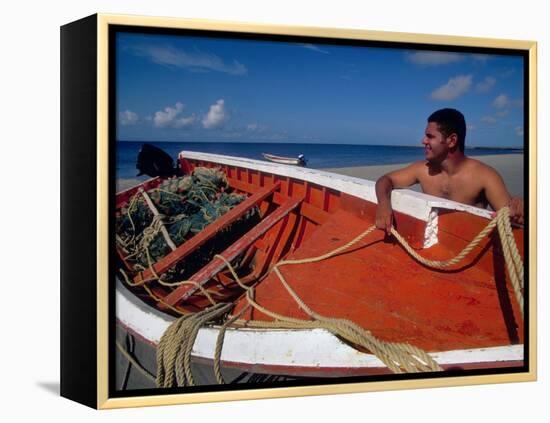 Fisherman Tends His Boat on the Beach, Isla Margarita, Venezuela-Greg Johnston-Framed Premier Image Canvas