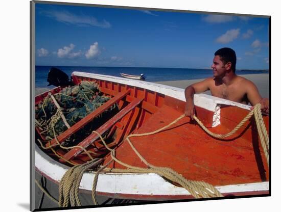 Fisherman Tends His Boat on the Beach, Isla Margarita, Venezuela-Greg Johnston-Mounted Photographic Print