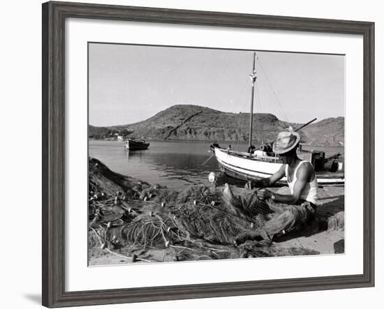 Fisherman Tends to His Nets in Greece-null-Framed Photographic Print