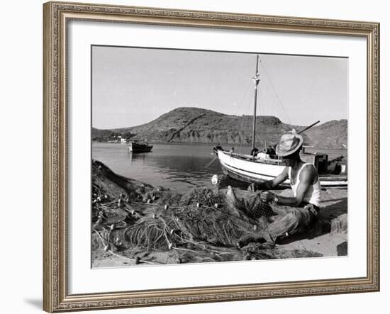 Fisherman Tends to His Nets in Greece-null-Framed Photographic Print