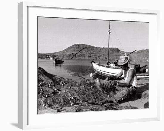 Fisherman Tends to His Nets in Greece-null-Framed Photographic Print