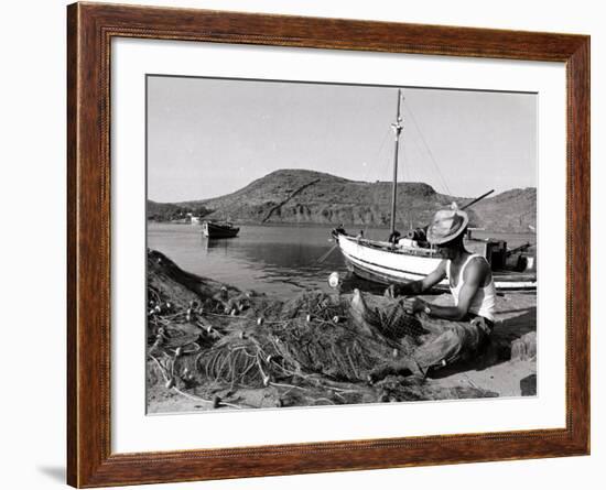 Fisherman Tends to His Nets in Greece-null-Framed Photographic Print