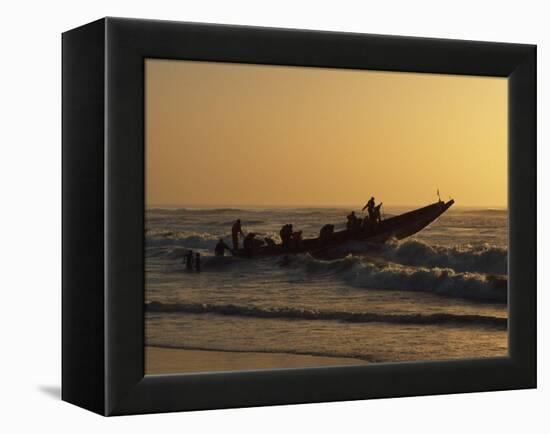 Fishermen Launch their Boat into the Atlantic Ocean at Sunset-Amar Grover-Framed Premier Image Canvas