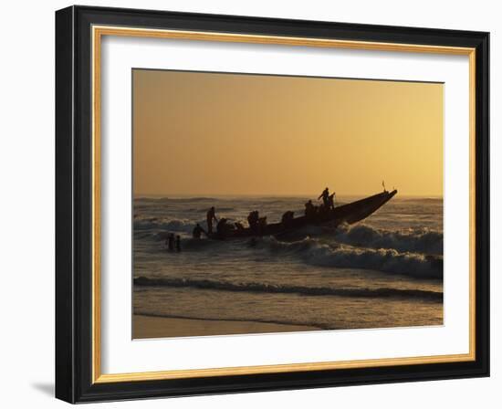 Fishermen Launch their Boat into the Atlantic Ocean at Sunset-Amar Grover-Framed Photographic Print