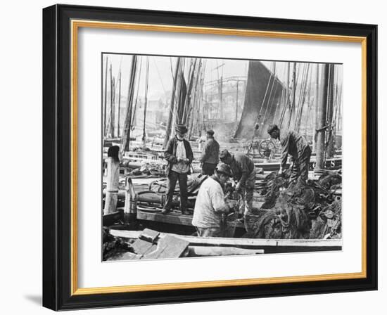 Fishermen Overhaul the Nets on Their Boats at Scarborough Yorkshire-Graystone Bird-Framed Photographic Print
