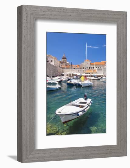 Fishing boat and clear water in the Old Port, Dubrovnik Old Town, Dubrovnik, Dalmatian Coast, Croat-Neale Clark-Framed Photographic Print