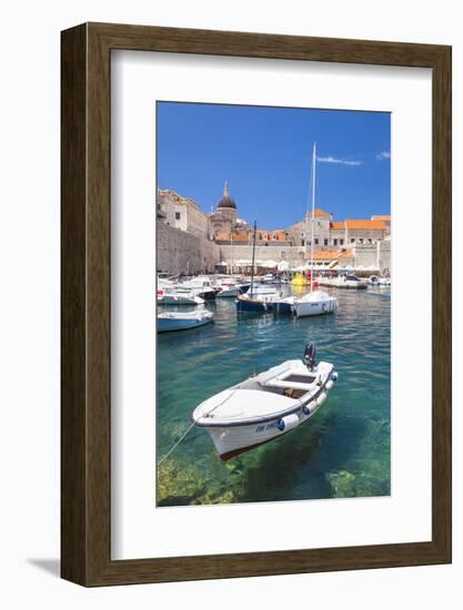 Fishing boat and clear water in the Old Port, Dubrovnik Old Town, Dubrovnik, Dalmatian Coast, Croat-Neale Clark-Framed Photographic Print