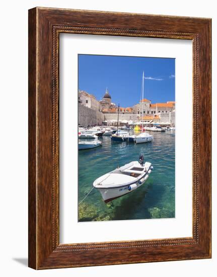 Fishing boat and clear water in the Old Port, Dubrovnik Old Town, Dubrovnik, Dalmatian Coast, Croat-Neale Clark-Framed Photographic Print