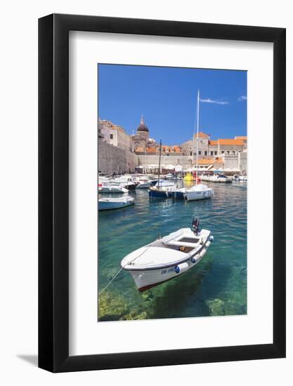 Fishing boat and clear water in the Old Port, Dubrovnik Old Town, Dubrovnik, Dalmatian Coast, Croat-Neale Clark-Framed Photographic Print