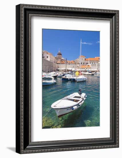 Fishing boat and clear water in the Old Port, Dubrovnik Old Town, Dubrovnik, Dalmatian Coast, Croat-Neale Clark-Framed Photographic Print