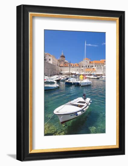 Fishing boat and clear water in the Old Port, Dubrovnik Old Town, Dubrovnik, Dalmatian Coast, Croat-Neale Clark-Framed Photographic Print