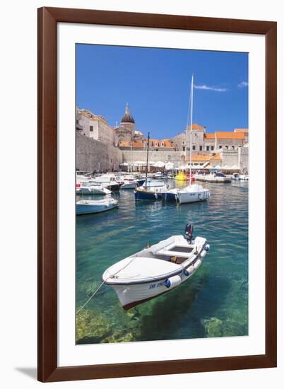 Fishing boat and clear water in the Old Port, Dubrovnik Old Town, Dubrovnik, Dalmatian Coast, Croat-Neale Clark-Framed Photographic Print