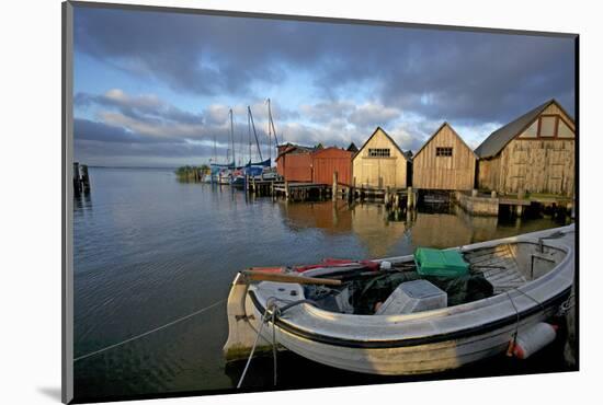 Fishing Boat in Front of the Boathouses in the Harbour of Ahrenshoop in the Saaler Bodden-Uwe Steffens-Mounted Photographic Print