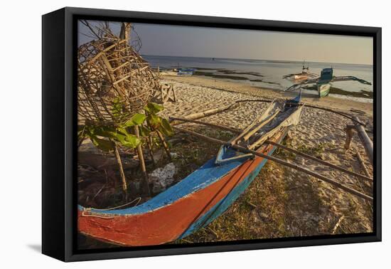 Fishing boats pulled up onto Paliton beach, Siquijor, Philippines, Southeast Asia, Asia-Nigel Hicks-Framed Premier Image Canvas