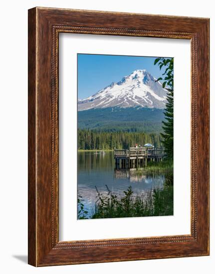 Fishing on Trillium Lake with Mount Hood, part of the Cascade Range, reflected in the still waters,-Martin Child-Framed Photographic Print