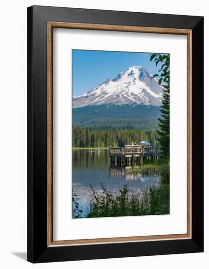 Fishing on Trillium Lake with Mount Hood, part of the Cascade Range, reflected in the still waters,-Martin Child-Framed Photographic Print