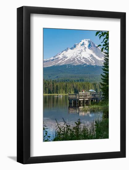 Fishing on Trillium Lake with Mount Hood, part of the Cascade Range, reflected in the still waters,-Martin Child-Framed Photographic Print