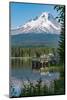 Fishing on Trillium Lake with Mount Hood, part of the Cascade Range, reflected in the still waters,-Martin Child-Mounted Photographic Print