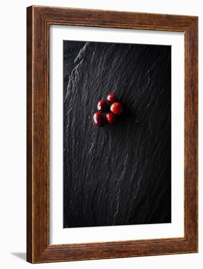 Five Cranberries Clustered In One Spot On Slate Background With Plenty Of Negative Space For Copy-Shea Evans-Framed Photographic Print