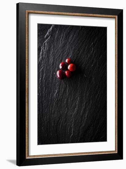 Five Cranberries Clustered In One Spot On Slate Background With Plenty Of Negative Space For Copy-Shea Evans-Framed Photographic Print