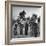 Five Male Musicians Dressed in Hats and Bib Overalls Standing in a Field-Eric Schaal-Framed Photographic Print