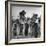 Five Male Musicians Dressed in Hats and Bib Overalls Standing in a Field-Eric Schaal-Framed Photographic Print