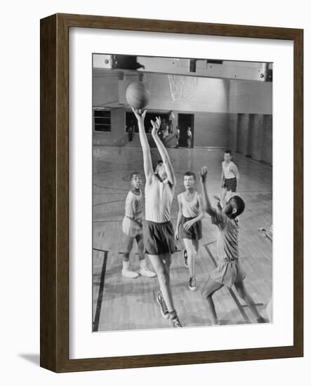 Five Young Boys Wearing Gym Clothes and Playing a Game of Basketball in the School Gym-null-Framed Photographic Print