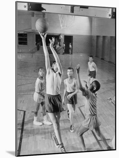 Five Young Boys Wearing Gym Clothes and Playing a Game of Basketball in the School Gym-null-Mounted Photographic Print