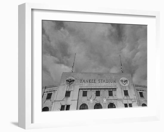 Flags Flying at Half Mast on Top of Yankee Stadium to Honor Late Baseball Player Babe Ruth-Cornell Capa-Framed Photographic Print
