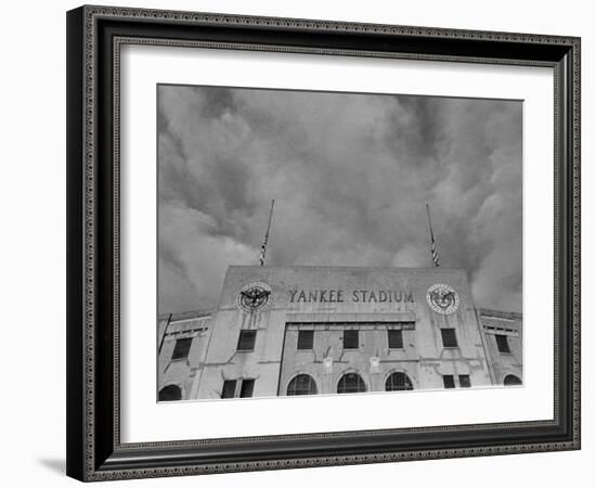 Flags Flying at Half Mast on Top of Yankee Stadium to Honor Late Baseball Player Babe Ruth-Cornell Capa-Framed Photographic Print