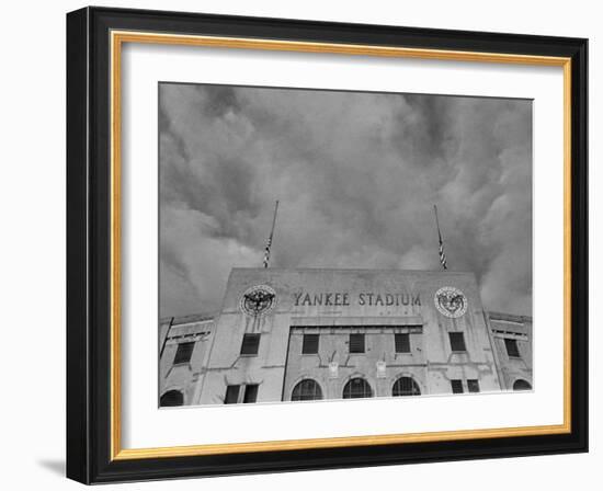 Flags Flying at Half Mast on Top of Yankee Stadium to Honor Late Baseball Player Babe Ruth-Cornell Capa-Framed Photographic Print