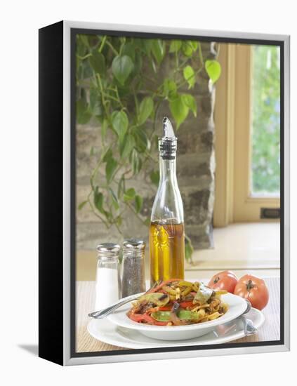 Flavored Oil and Salt and Pepper Shakers Beside Bowl of Pasta-null-Framed Premier Image Canvas