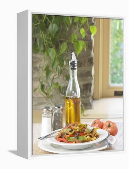 Flavored Oil and Salt and Pepper Shakers Beside Bowl of Pasta-null-Framed Premier Image Canvas