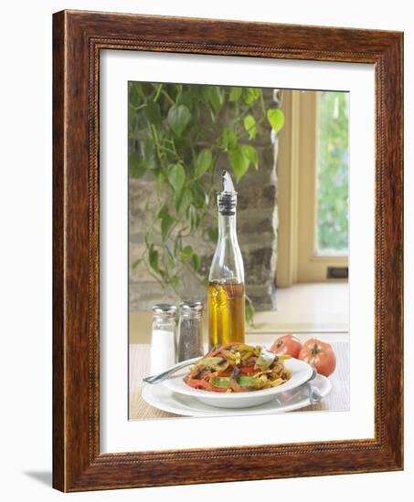 Flavored Oil and Salt and Pepper Shakers Beside Bowl of Pasta-null-Framed Photographic Print