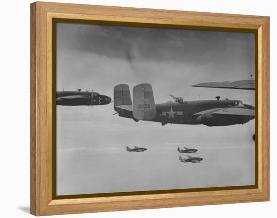 Flight of American B-25 Mitchell Bombers Enroute to a Bombing Mission over the Port of Madang-Myron Davis-Framed Premier Image Canvas