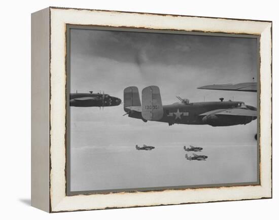 Flight of American B-25 Mitchell Bombers Enroute to a Bombing Mission over the Port of Madang-Myron Davis-Framed Premier Image Canvas