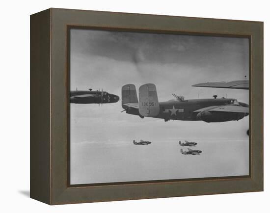 Flight of American B-25 Mitchell Bombers Enroute to a Bombing Mission over the Port of Madang-Myron Davis-Framed Premier Image Canvas