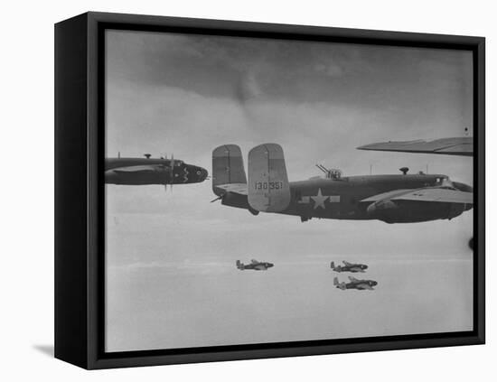 Flight of American B-25 Mitchell Bombers Enroute to a Bombing Mission over the Port of Madang-Myron Davis-Framed Premier Image Canvas