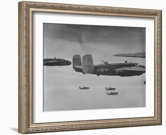 Flight of American B-25 Mitchell Bombers Enroute to a Bombing Mission over the Port of Madang-Myron Davis-Framed Photographic Print