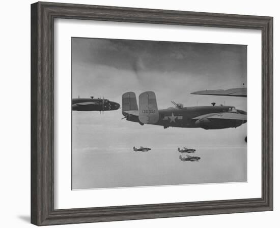 Flight of American B-25 Mitchell Bombers Enroute to a Bombing Mission over the Port of Madang-Myron Davis-Framed Photographic Print