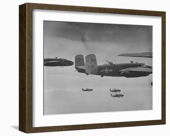 Flight of American B-25 Mitchell Bombers Enroute to a Bombing Mission over the Port of Madang-Myron Davis-Framed Photographic Print