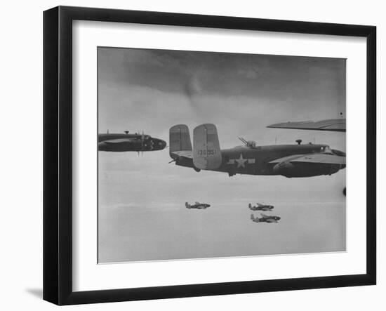 Flight of American B-25 Mitchell Bombers Enroute to a Bombing Mission over the Port of Madang-Myron Davis-Framed Photographic Print