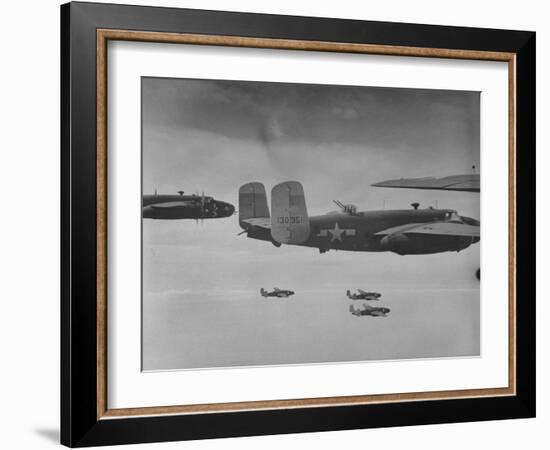 Flight of American B-25 Mitchell Bombers Enroute to a Bombing Mission over the Port of Madang-Myron Davis-Framed Photographic Print