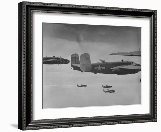 Flight of American B-25 Mitchell Bombers Enroute to a Bombing Mission over the Port of Madang-Myron Davis-Framed Photographic Print